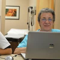 <p>Laura Franco Zapata, volunteer interpreter, left, and Nancy Baker, volunteer registered nurse, at Bergen Volunteer Health Initiative.</p>
