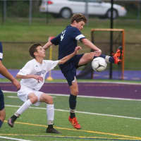 <p>Walter Panas and John Jay locked horns on the soccer field Wednesday at Cross River.</p>