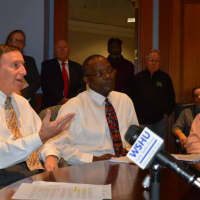 <p>Bridgeport Finance Director Ken Flatto, left, and Nestor Nkwo, director of the Office of Policy and Management, right, discuss the city&#x27;s budget challenges Friday.</p>