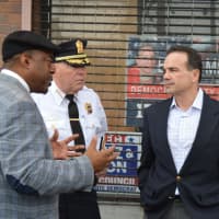<p>Harold Dimbo of Project Longevity, left, talks with Bridgeport Police Chief A.J. Perez and Mayor Joe Ganim.</p>