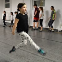<p>In rehearsal at S. Mary&#x27;s Dumont, Irish dancer Kelsey Lawyer of Dumont takes a flying leap. All the dancers at the McLoughlin School of Irish Dance have been readying themselves for their busiest time of year: March.</p>