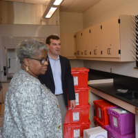 <p>State Sen. Marilyn Moore and state Rep. Steve Stafstrom tour the science preparation lab at Geraldine Claytor Magnet Academy.</p>