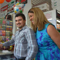 <p>Darwin Aguirre Portillo cuts a celebratory cake after winning a $2.5 million lottery prize.</p>
