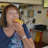 <p>Nicki Hotra of West Milford enjoys a hot dog at Rutt&#x27;s Hut in Clifton.</p>