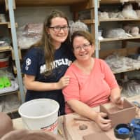 <p>Kathleen Boylan of Clifton enjoys a pottery class with her daughter, Madeline Erdman, 15.</p>