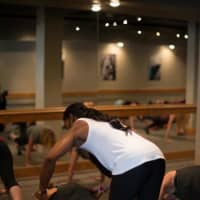 <p>It&#x27;s not only about the ballet barre – owner Ashley Allen leads a class at Pure Barre Greenwich.</p>