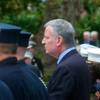 <p>Thousands of firemen, NYPD, public officials and civilian attendees lined the streets around the Church of the Annunciation to mourn FDNY Battalion Chief Michael Fahy, killed Tuesday in a Bronx building explosion. Pictured: NYC Mayor Bill de Blasio.</p>