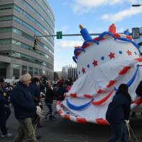 <p>The giant birthday cake started to deflate near the end of the parade route.</p>