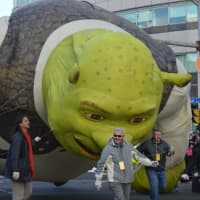 <p>Shrek dragged his knuckles on the ground, but managed to make it down the parade route Sunday.</p>