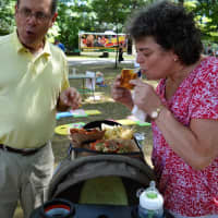 <p>Debbie Fearon of Waldwick and Norman Levine of Ramsey lay out their feast atop a stroller.</p>
