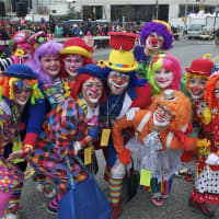 <p>A group of clowns poses for a photo.</p>