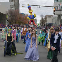 <p>The Stamford Parade makes its way down Atlantic Street.</p>