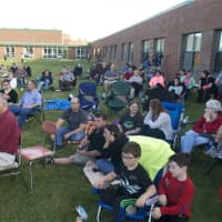 <p>A good size crowd watches the concert Friday night at Dover High School.</p>