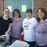 <p>Volunteers serve up food at Friday&#x27;s concert.</p>