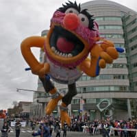 <p>One of the giant balloons says hello to the crowd.</p>