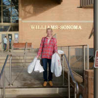 <p>This shopper has her hands full after a morning of shopping at the Danbury Fair Mall on Black Friday. </p>