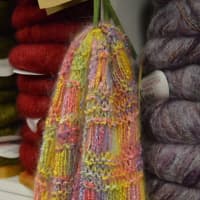 <p>A knitted rainbow scarf at Yarn Diva.</p>