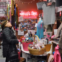 <p>A customer searches for treasure in the Diva&#x27;s Den corner of the Yarn Diva in Hillsdale.</p>