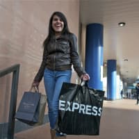 <p>This woman is all smiles after finding gift items on Black Friday.</p>