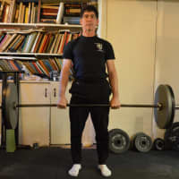 <p>Steve Freides deadlifting in his basement. There was a time he was bedridden.</p>