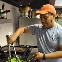 <p>Victor Sanchez cooks up some cactus in his Teaneck restaurant.</p>