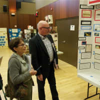 <p>Judges check out the history projects Saturday at Sacred Heart University.</p>
