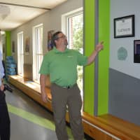 <p>Jason Macchia, right, explains the energy-efficient features at the Smilow-Burroughs Clubhouse in Bridgeport to Mayor Joe Ganim and U.S. Sen. Chris Murphy.</p>