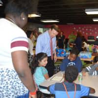 <p>U.S. Sen. Chris Murphy talks with kids at the Smilow-Burroughs Clubhouse in Bridgeport.</p>