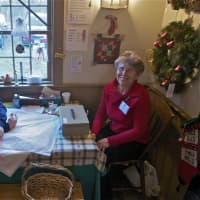 <p>Volunteers work at the Monroe Historical Society&#x27;s Christmas Fair Sunday.</p>