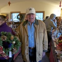<p>A satisfied customer leaves The Monroe Historical Society&#x27;s Christmas Fair with a wreath.</p>
