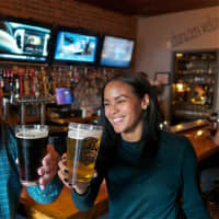 <p>Customers enjoy a variety of craft brews available at Clock Tower Grill.</p>