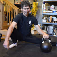 <p>Steve Freides stretching with a kettlebell.</p>