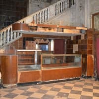 <p>The old concession stand at the Majestic Theater is tucked near the stairs to the mezzanine.</p>