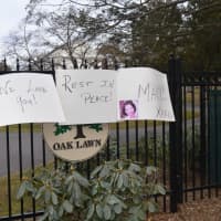 <p>Fan left signs at Oak Lawn Cemetery, Mary Tyler Moore&#x27;s final resting place.</p>