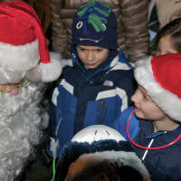 <p>Santa chats with children at Sunday&#x27;s event.</p>