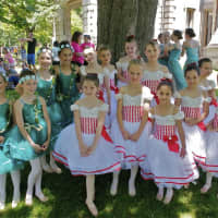 <p>Girls from the Darien Academy of Dance pose for a photo before their performance Sunday.</p>