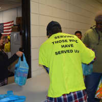 <p>Bridgeport Health Director Maritza Bond helps hand out Thanksgiving ingredients at the annual Veterans Affairs Thanksgiving distribution for veterans.</p>