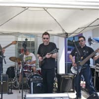 <p>Local band &#x27;Phoenix Tree&#x27; performs at the street festival.</p>