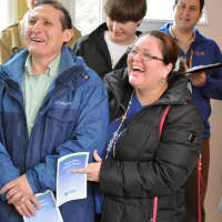 <p>Carlos and Geovana Pimentel enjoying their warm welcome to their new home on Bergen Avenue in Bergenfield.</p>