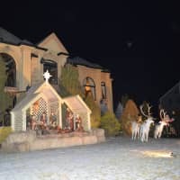 <p>A Franklin Lakes yard is decorated with a large manger and deer.</p>