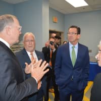 <p>Sikorsky President Dan Schultz discusses manufacturing with HCC Advanced Manufacturing Director Richard DuPont, Gov. Dannel Malloy and Lt. Gov. Nancy Wyman at Housatonic Community College.</p>
