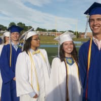 <p>Frank Scott Bunnell High School holds its 56th commencement ceremony Wednesday afternoon, with thousands of people lining the track and filling the bleachers on both sides of the field to view an outdoor ceremony on the football field.</p>