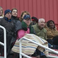 <p>Fans watch the chilly lacrosse season opener Thursday at Fox Lane.</p>