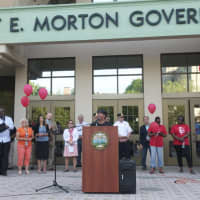 <p>A small crowd showed up for a vigil Wednesday evening in front of the Margaret E. Morton Government Center.</p>