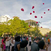<p>The crowd releases balloons to remember those lost in the Orlando mass shooting.</p>