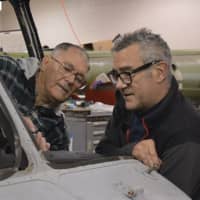 <p>Charlie Vesterman and Tim Benson work on an aircraft at the Connecticut Air and Space Center.</p>