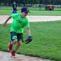<p>Action on the third-base line at Finch Park as the Ramsey Little League team of 11-year-olds practices for the state championship.</p>