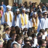 <p>Fairfield Warde High School holds its 12th commencement ceremony, with graduates, family and friends packing the outdoor courtyard on a sunny and warm Thursday evening at the school.</p>