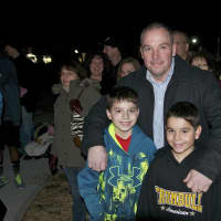 <p>A family at the Trumbull tree lighting ceremony.</p>
