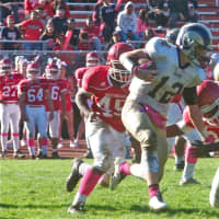 <p>Michael Piscani (12) runs the ball for the Rams.</p>